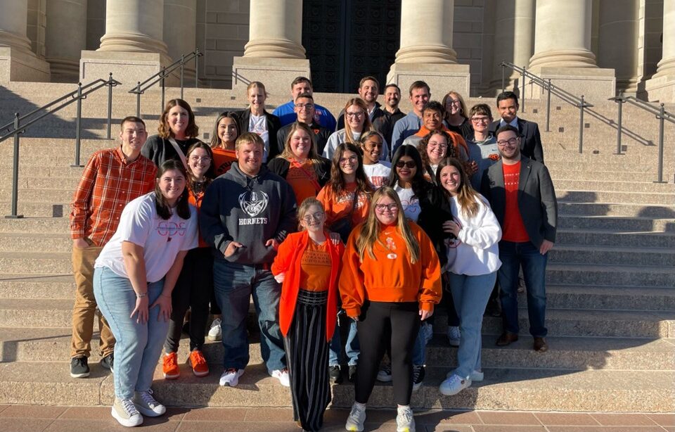 Group of students from OSU's OPPORTUNITY ORANGE SCHOLARS. Standing on stairs.