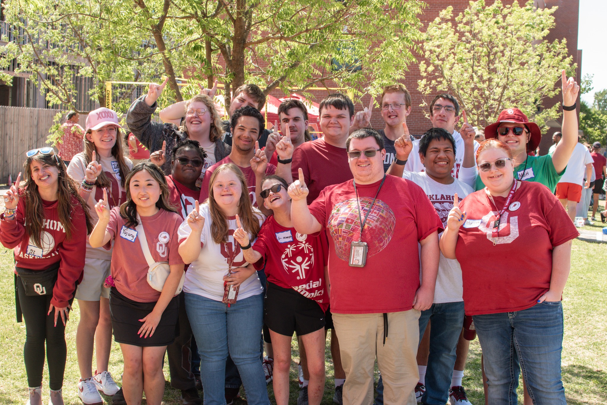 Students from the University of Oklahoma Sooner Works Group. All students are wearing OU paraphernalia.