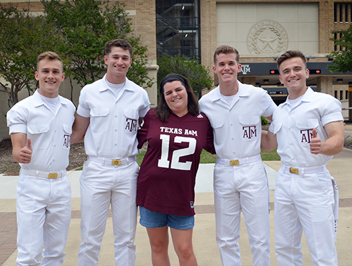 Callie Colgrove linking arms with other students from Texas State University.