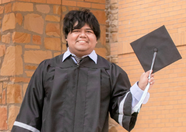 Graduating student from the TU CASA Program. Student is wearing a graduation gown and holding his cap.