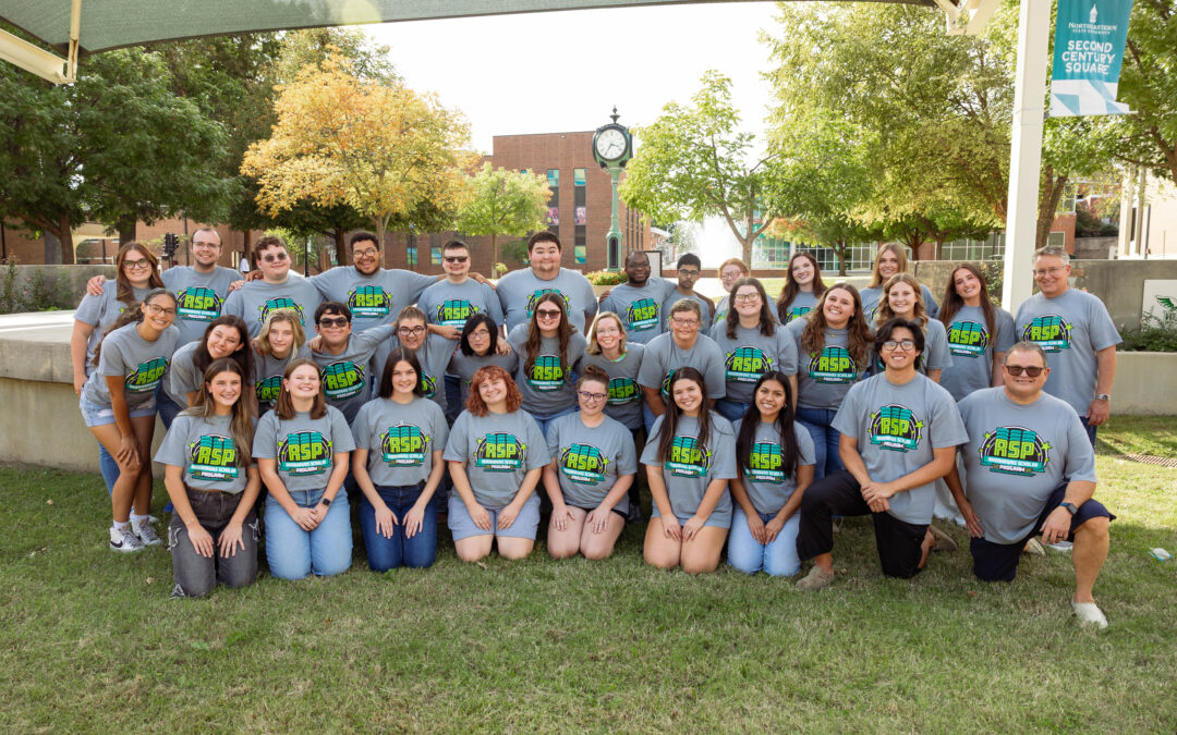 Group of people in matching RSP logo shirts.
